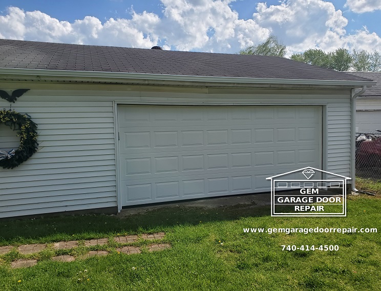 Garage door repaired after vehicle impact